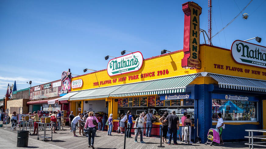 Nathan’s Famous hot dogs are meant to be enjoyed, not just scarfed down in eating contests. Credit: Mattia Panciroli, flickr
