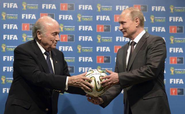Putin blasts U.S. over FIFA takedown; backs soccer boss Blatter in elex