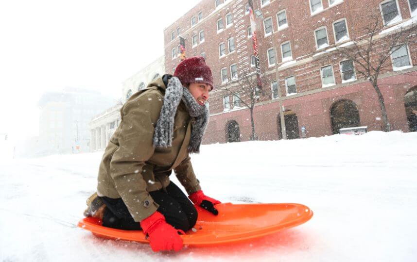 Boston students home a third day; NYC sends snow-bound city melters