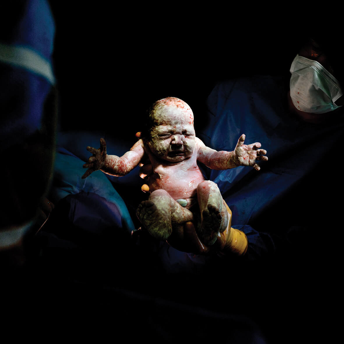 Photographer Christian Berthelot captures babies when they are born
