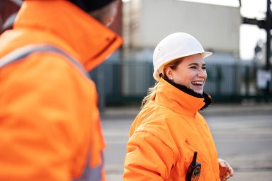 Smiling female engineer at the shipyard