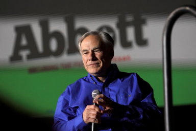 FILE PHOTO: Texas Governor Greg Abbott speaks during a rally, in Conroe