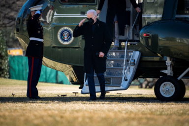 FILE PHOTO: U.S. President Joe Biden salutes as he arrives on Marine One on the South Lawn of the White House in Washington