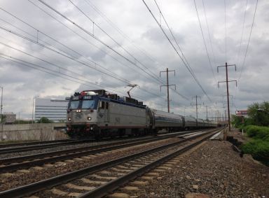 2014-05-15_15_01_21_Amtrak_train_heading_south_along_the_Northeast_Corridor_rail_line_in_Trenton_New_Jersey-1200×886-1