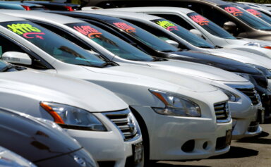 FILE PHOTO: Automobiles are shown for sale at a car dealership in Carlsbad, California