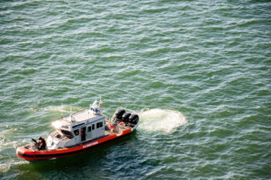 Coast guard boat on green water