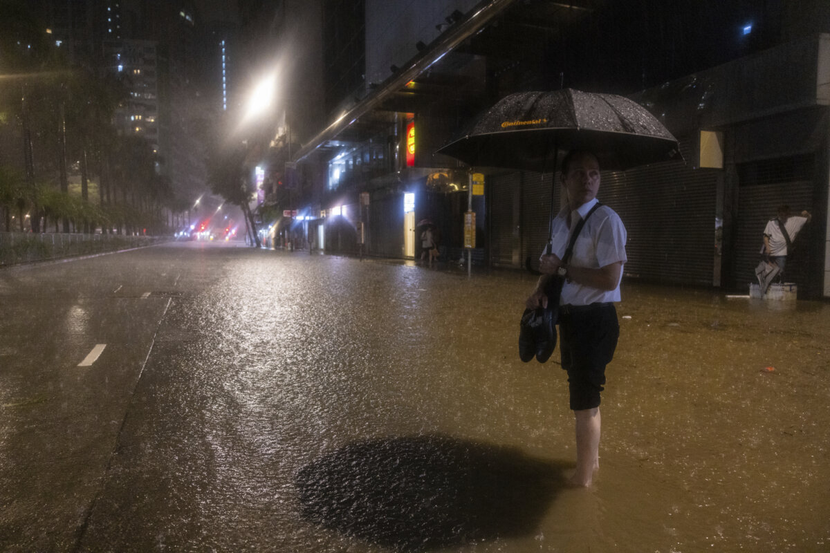 Hong Kong closes schools as torrential rain floods streets, subway ...