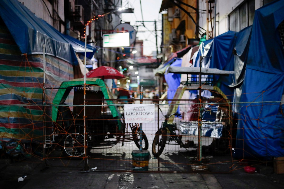 FILE PHOTO: Makeshift barricades block some streets to contain the