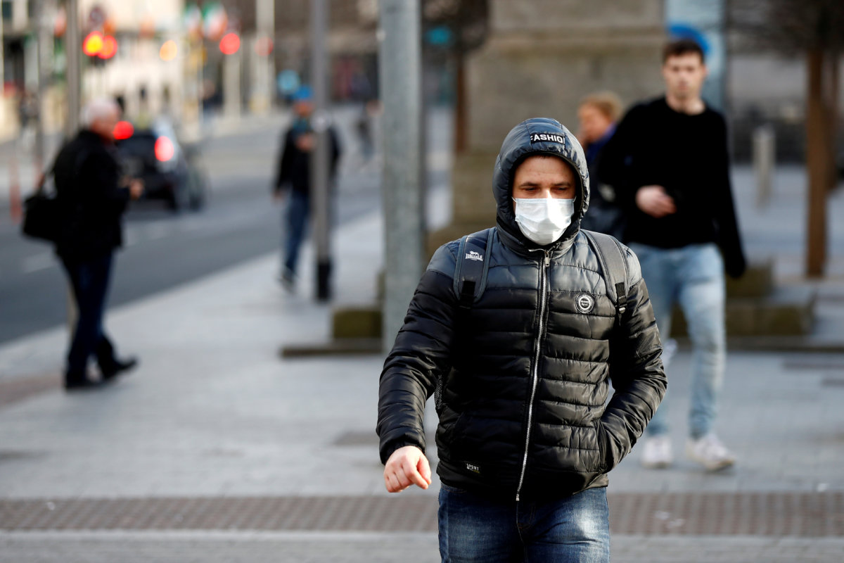 FILE PHOTO: A man wearing a face mask on St.