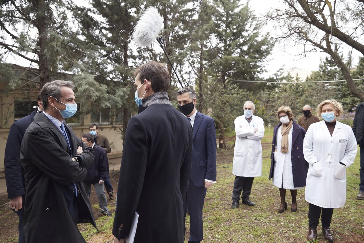Greek Prime Minister Kyriakos Mitsotakis wears a protective face mask