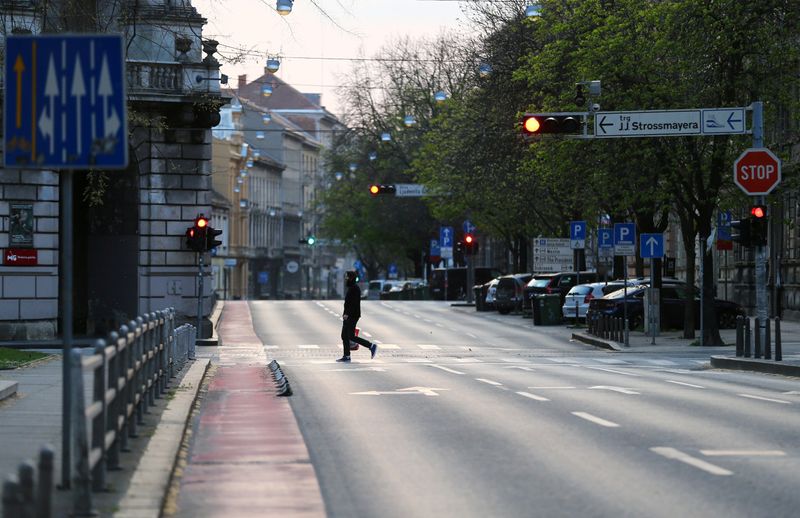 FILE PHOTO: A man crossing a street as Croatia is