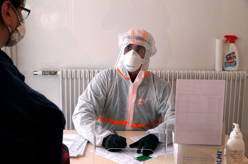 FILE PHOTO: A French doctor wearing a protective suit works