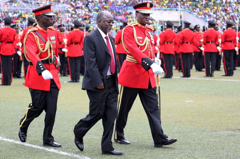 FILE PHOTO: Tanzania’s President-elect Magufuli is escorted after inspecting a