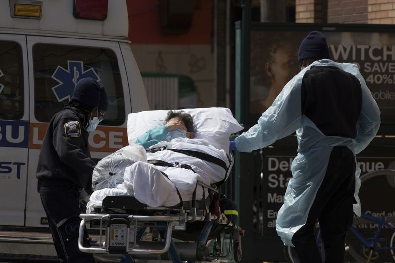 FILE PHOTO: A patient is wheeled from Wyckoff Heights Medical