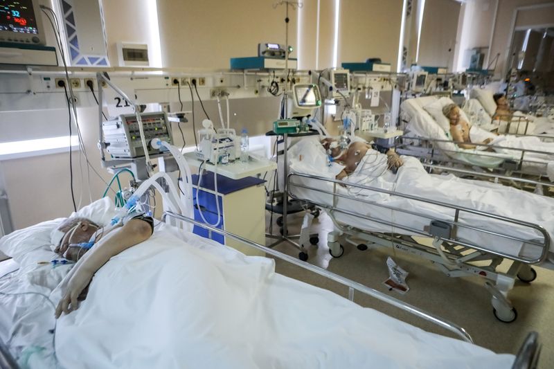 Patients lie in an intensive care unit of a hospital