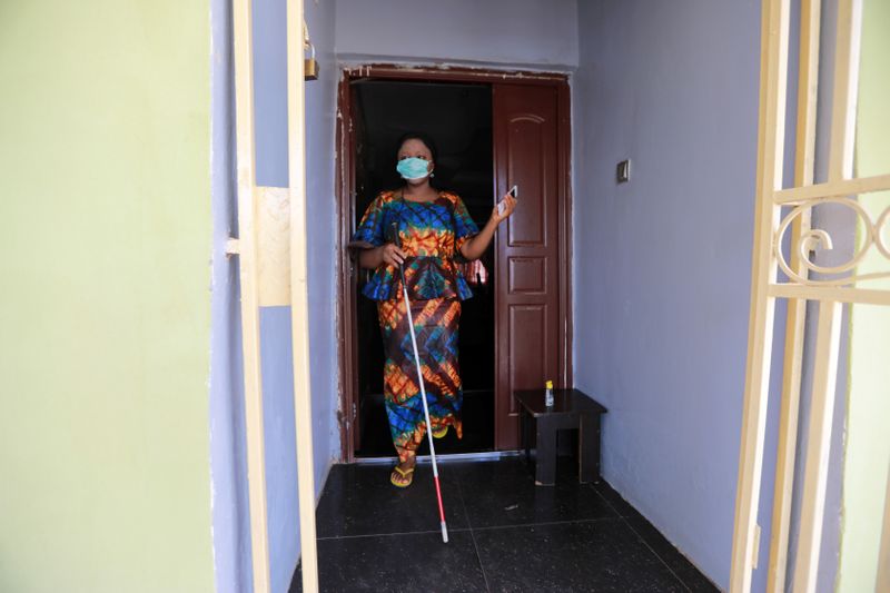 Visually impaired Juliet Gbefwi, president, Yeyedu Outreach Foundation, walks out