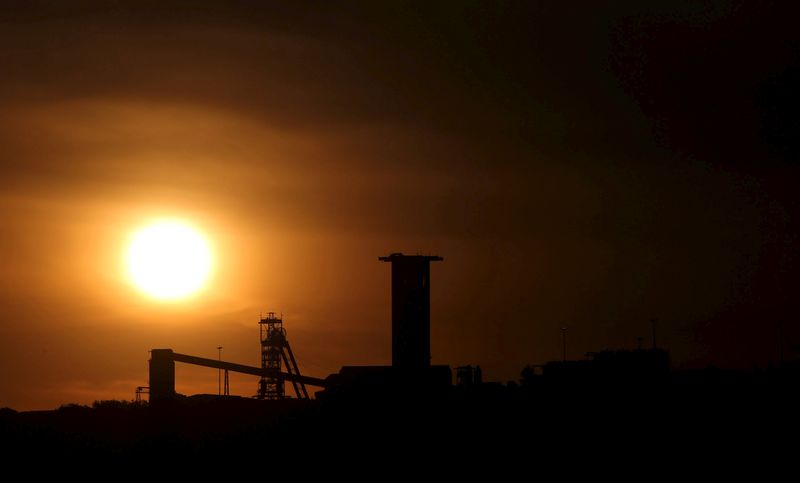 FILE PHOTO: Sun sets behind a shaft outside the mining
