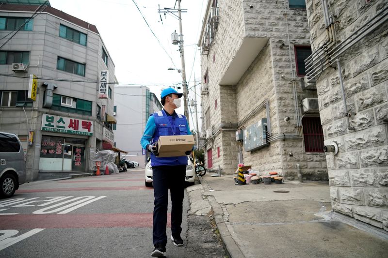 FILE PHOTO: A delivery man for Coupang Jung Im-hong wearing