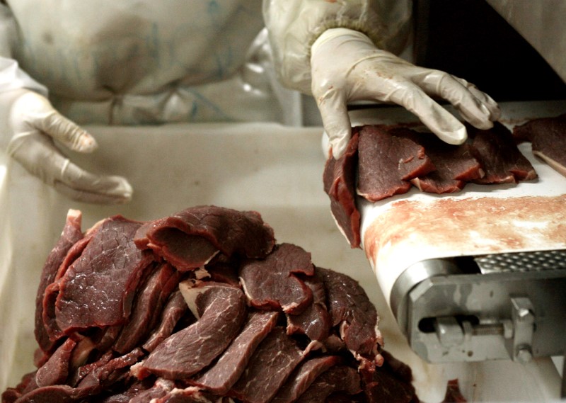 FILE PHOTO: File photo of a butcher chopping pieces of
