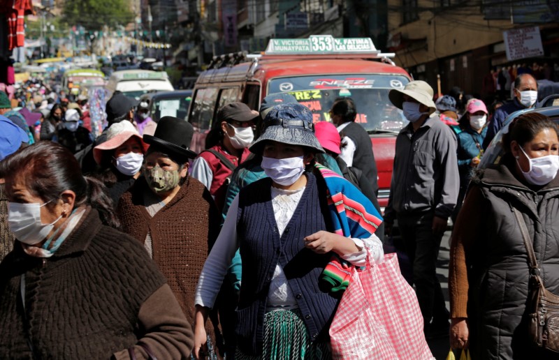 FILE PHOTO:  People wearing face masks are seen on