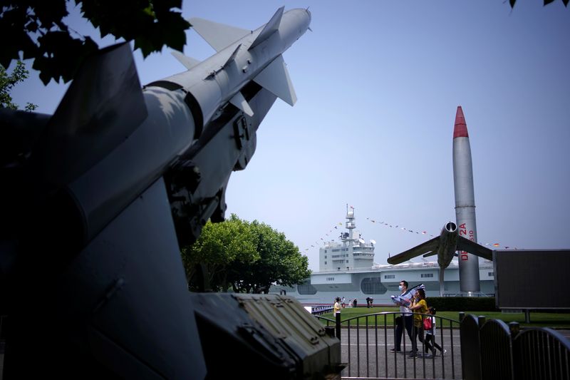 FILE PHOTO: People visit a military theme park following an