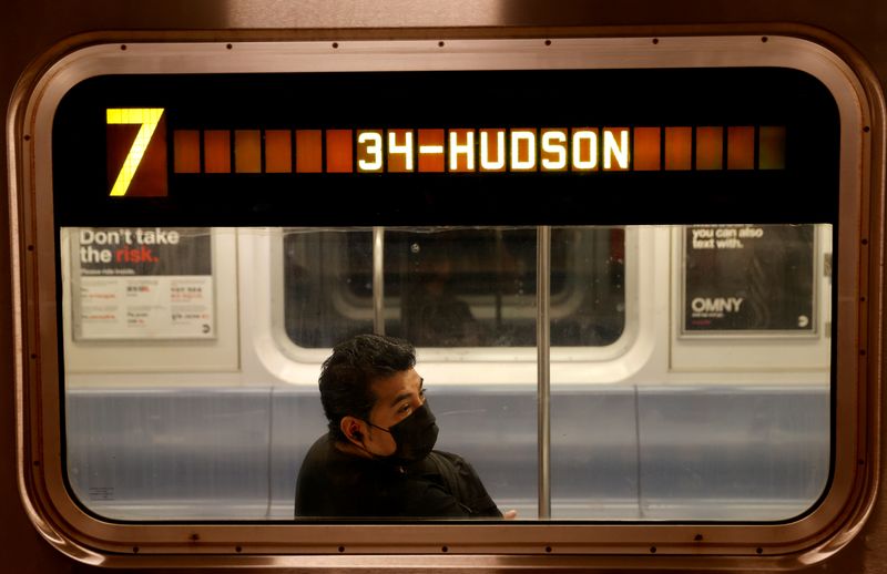 Commuters ride subway in Manhattan on first day of phase