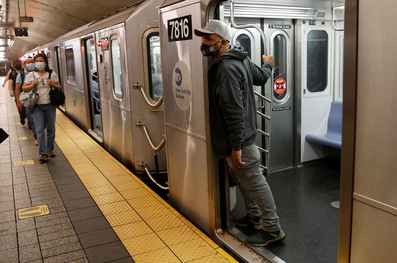 FILE PHOTO: Commiuters ride subway in Manhattan on first day