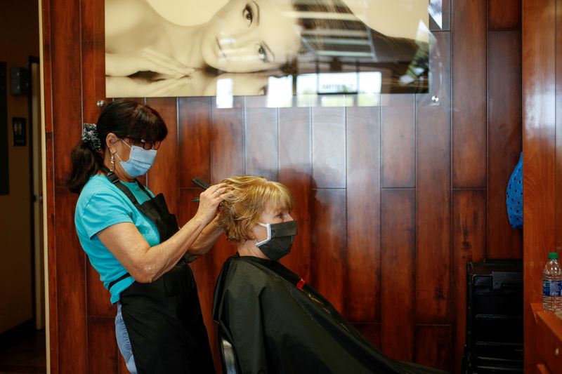 FILE PHOTO: Donna Ferraro cuts and styles Jan Campbell?s hair
