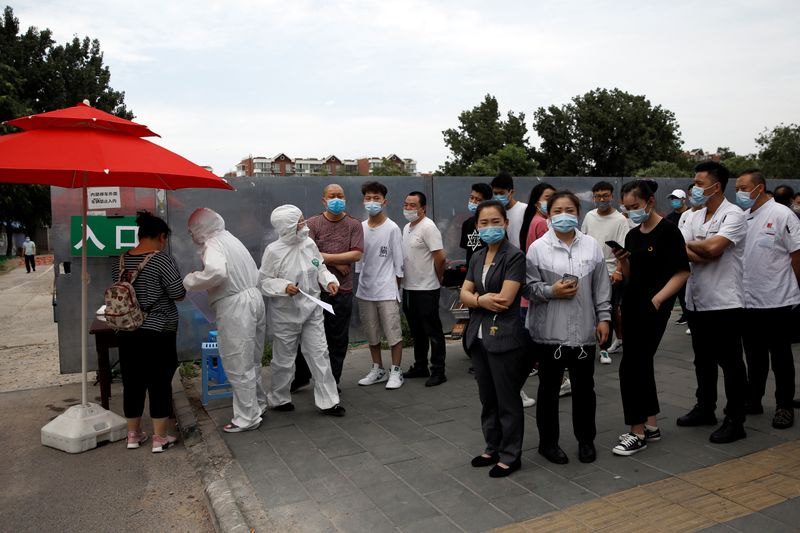 People line up outside a site for nucleic acid tests