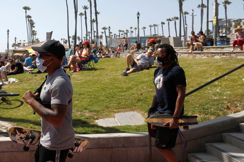 FILE PHOTO:  People recreate at the beach on Memorial