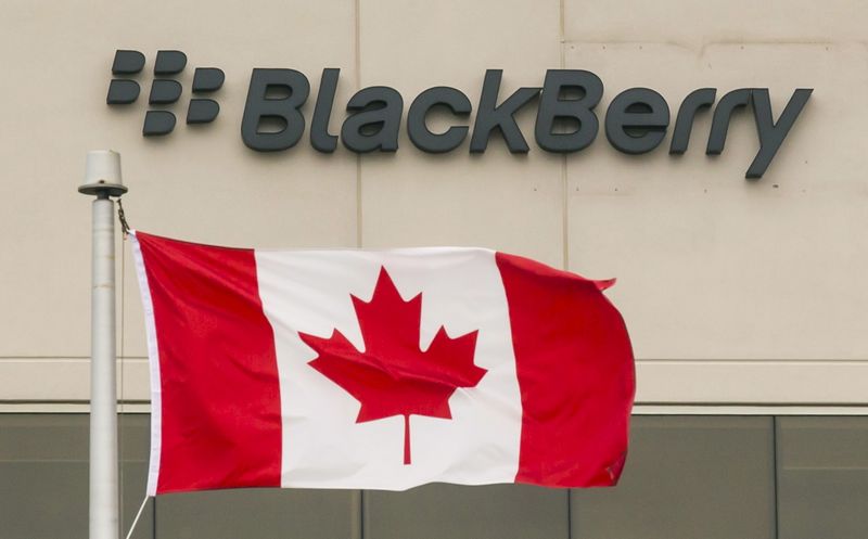 A Blackberry logo hangs behind a Canadian flag at their