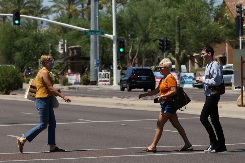 People cross the street between Kierland Commons and Scottsdale Quarter