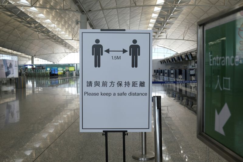 A social distancing sign is seen at the Hong Kong
