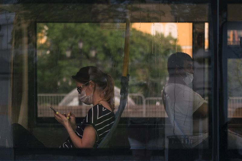 Passengers sit in a bus in Moscow