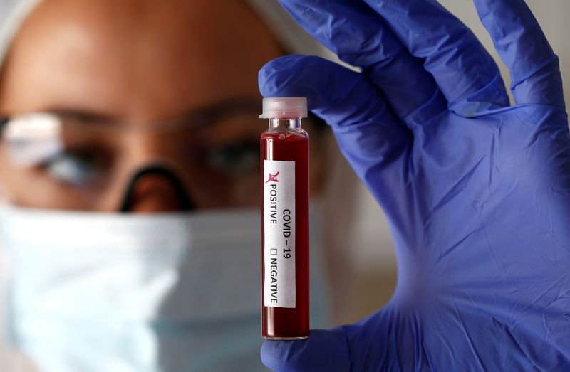 FILE PHOTO: Fake blood is seen in test tubes labelled