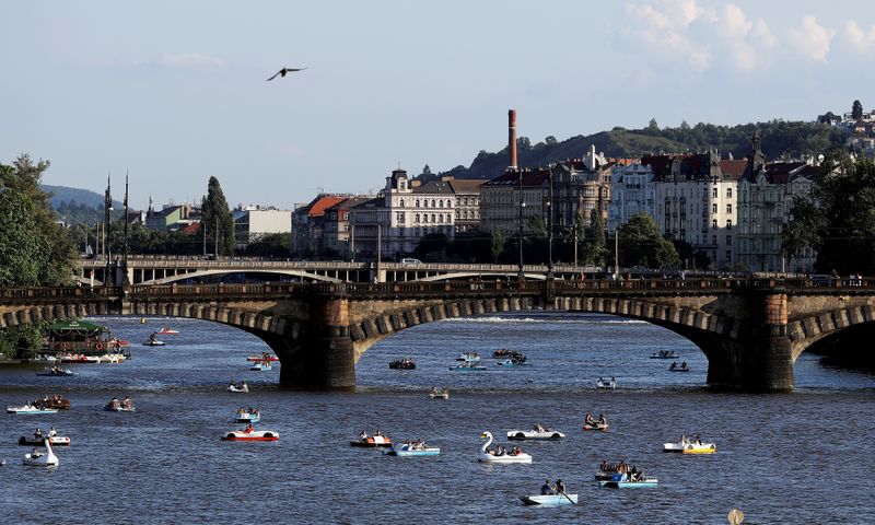 FILE PHOTO: People ride pedal boats on the Vltava river