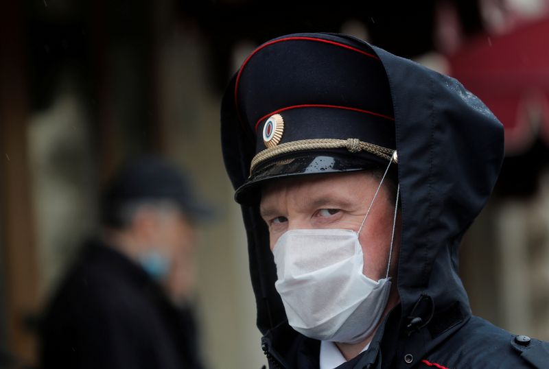FILE PHOTO: A law enforcement officer wearing a protective mask