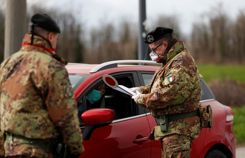 FILE PHOTO: Members of the Italian army guard the entrance