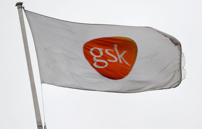 A GSK logo is seen on a flag at a