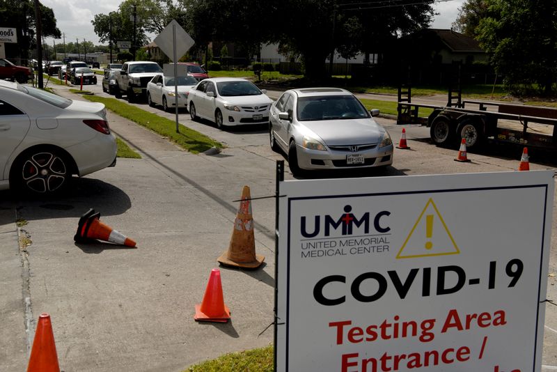 People wait in long lines for COVID-19 testing in Houston