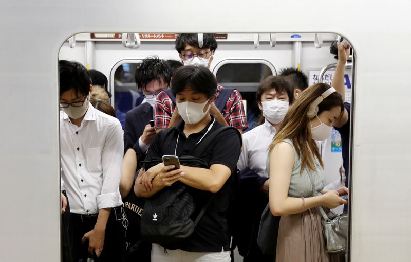 Passengers wearing protective masks amid the coronavirus disease (COVID-19) outbreak,