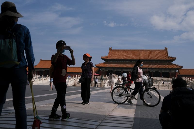 Visitors are seen at the Forbidden City following the outbreak