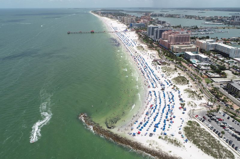 Sun seekers gather at Clearwater Beach on Independence Day