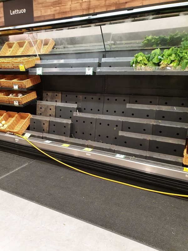 Near empty shelves are seen at a supermarket in Melbourne