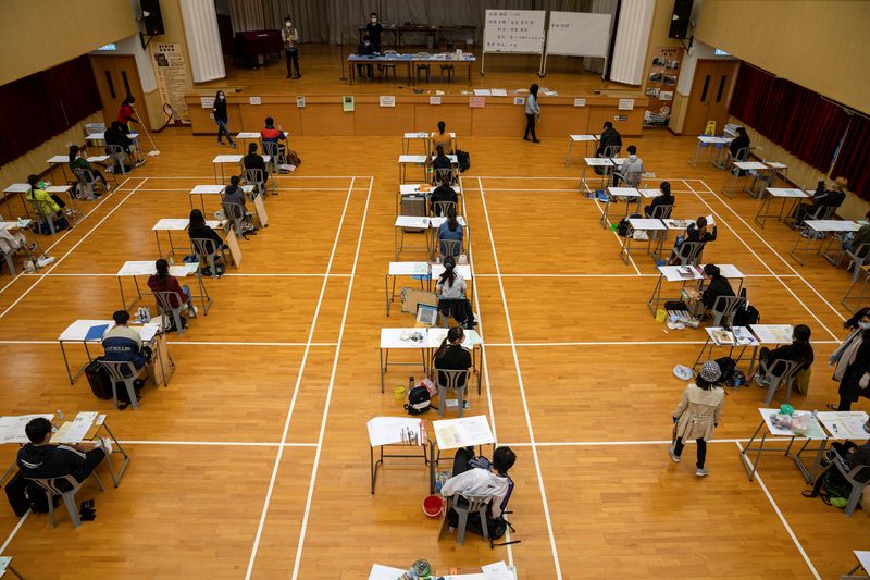 FILE PHOTO: Students attend to take the Diploma of Secondary