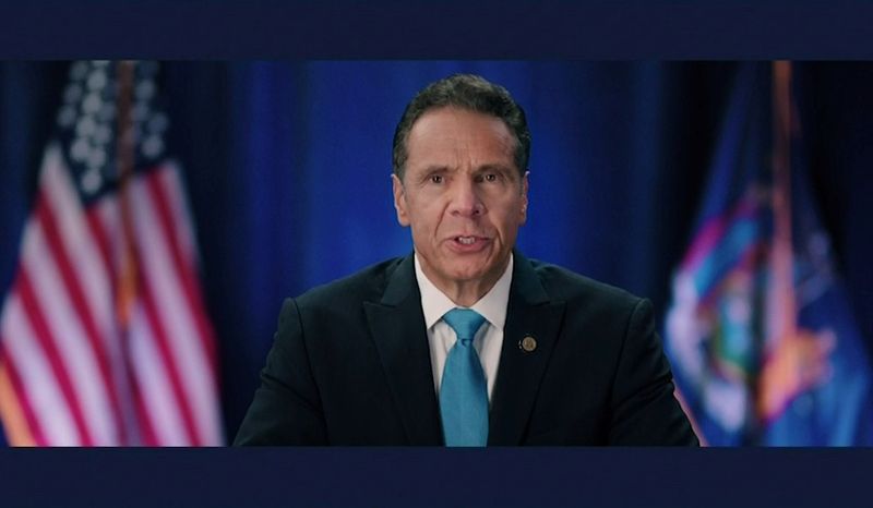 New York Governor Andrew Cuomo speaks by video feed at