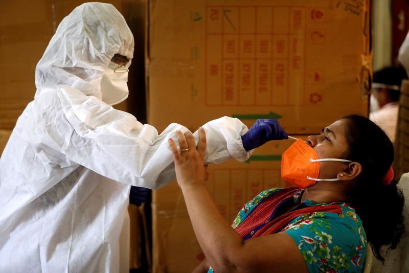 FILE PHOTO: A health worker in personal protective equipment (PPE)