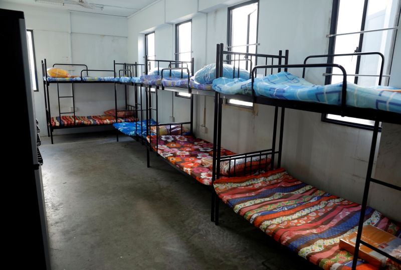 FILE PHOTO: View of a dormitory room for migrant workers