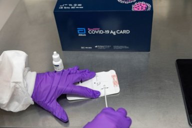 abbott rapid binaxnow coronavirus binax extraction reagent antigen pcr accurate hhs woes pandemic swab fig