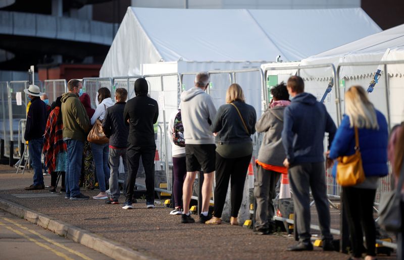 People queue outside a test centre in Southend-on-sea